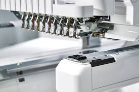 Embroidery machine representing custom apparel work from The Off-Duty Fireman Clothing Company